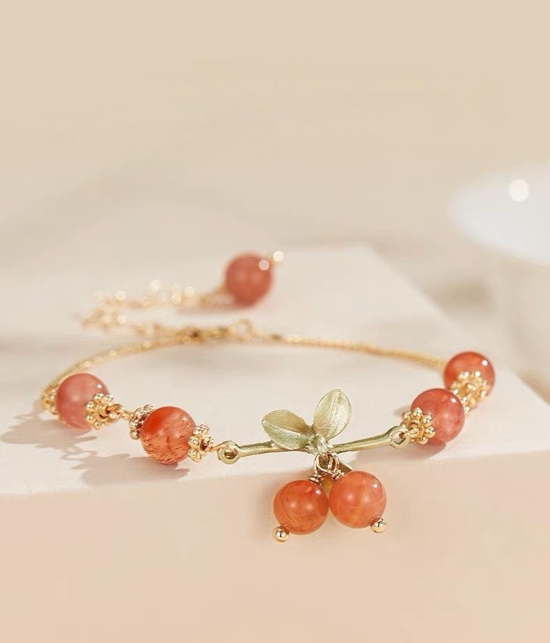 Blue blossom serenity pearl bangle bracelet with wooden charm for radiant vitality.