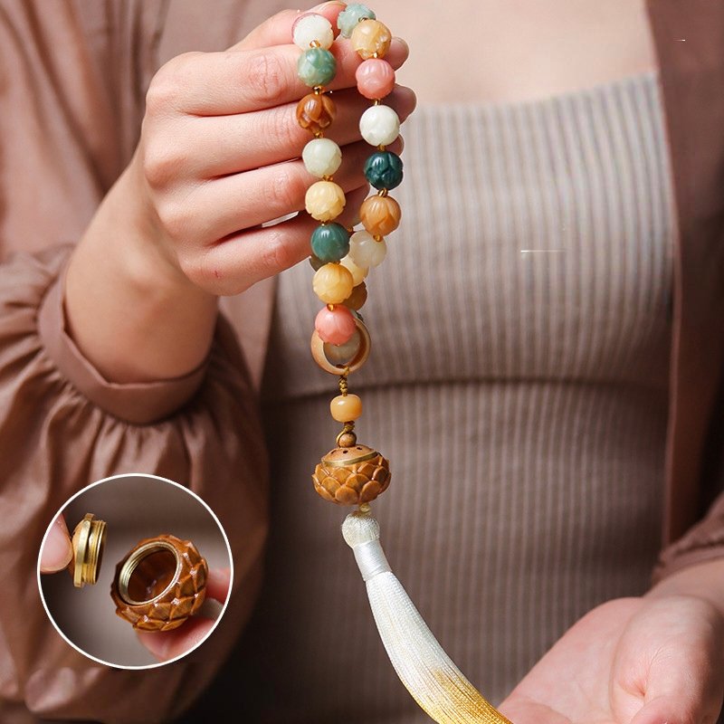 Blue Eternal Lotus Jade pendant on 14k gold chain, attracting wealth and blessings.