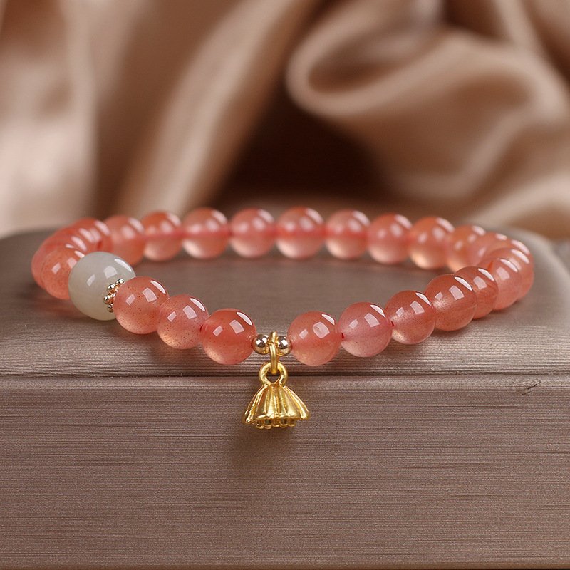 Crimson lotus ember bracelet bangle with fiery charm detail.
