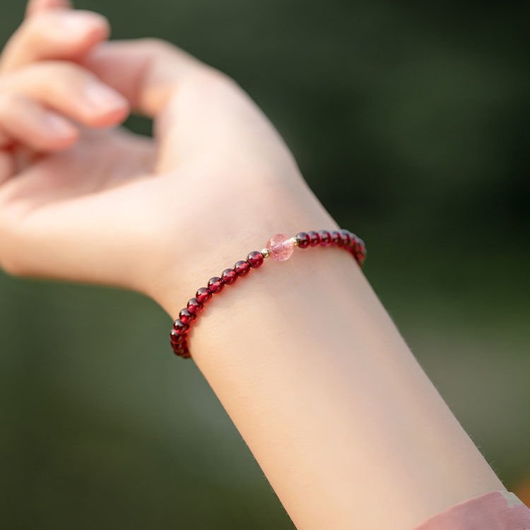 Adjustable vermilion garnet bangle bracelet for energy balance and prosperity.