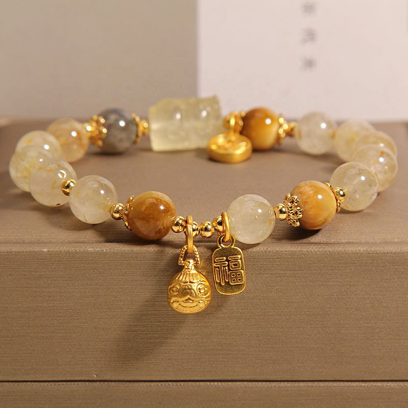 Metal-forged Aurelian Radiance bangle bracelet charm for fortune and harmony.