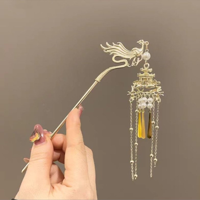 Blue Phoenix Perch Cloudpin hairpin with elegant metal detailing.