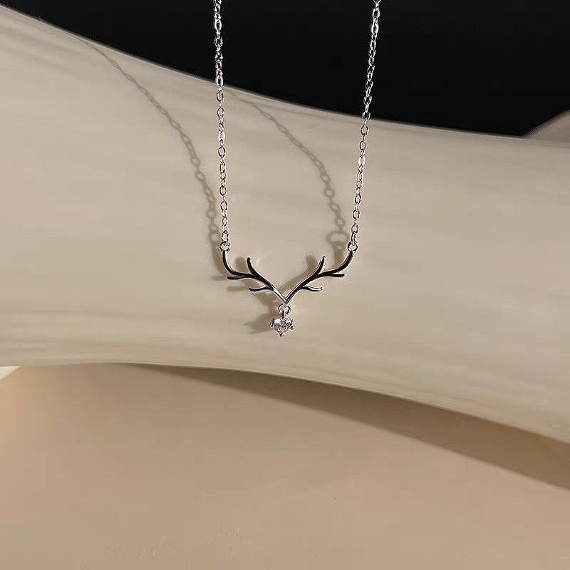 Silver stag blessing necklace charm with ancient Chinese motifs, artisan jewelry.