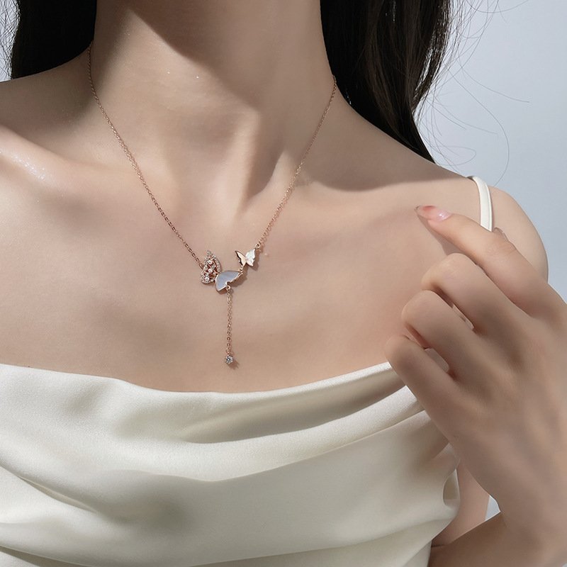 Silverwing Harmony Necklace close-up, artisan lucky charm with elegant metal details.