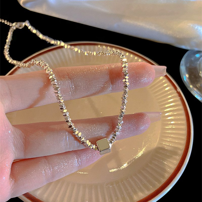 Silver Nexus charm necklace with harmonizing metal energy for balance.