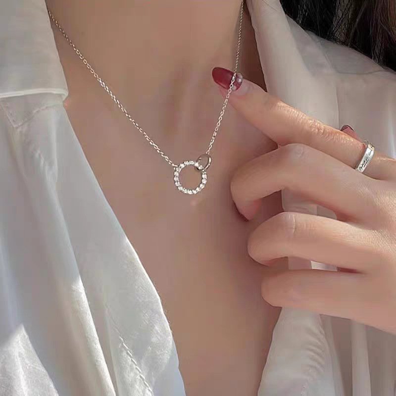 Lunar Frost silver charm necklace with celestial design and secure necklace backing.