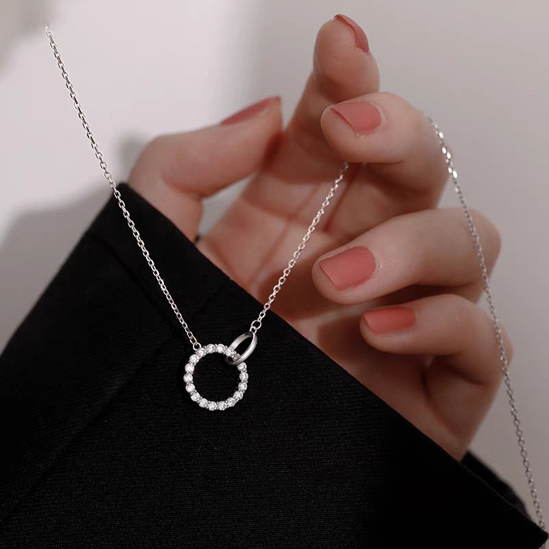 Lunar Frost silver charm necklace with celestial design, showcasing necklace backing.