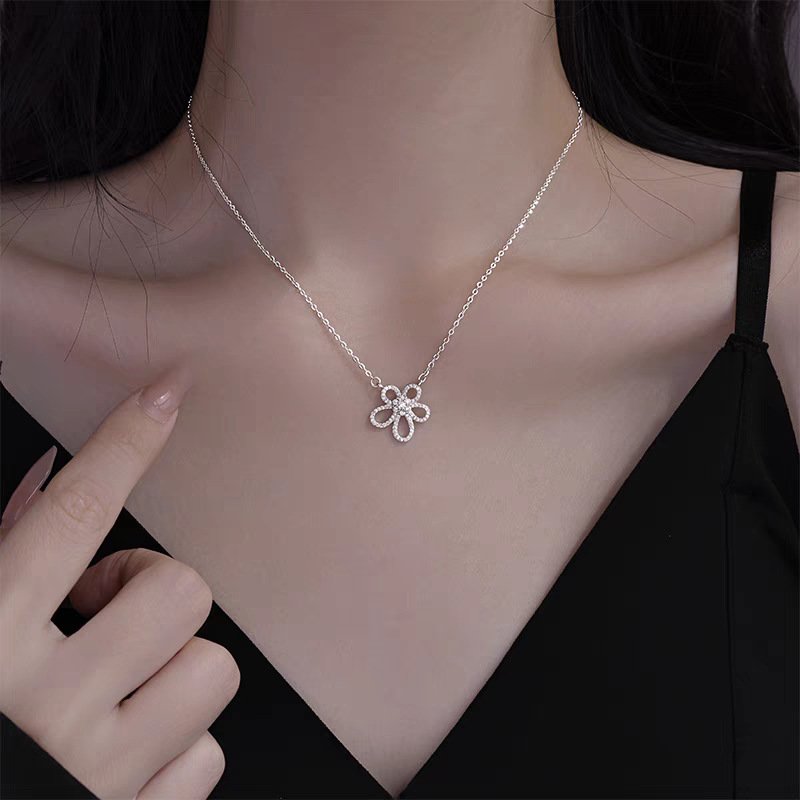 Silver Blossom charm necklace with elegant metal balance, inspired by ancient Chinese harmony.