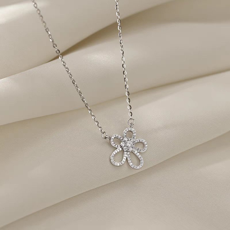 Silver Blossom Charm Necklace with elegant Chinese harmony-inspired metal balance.