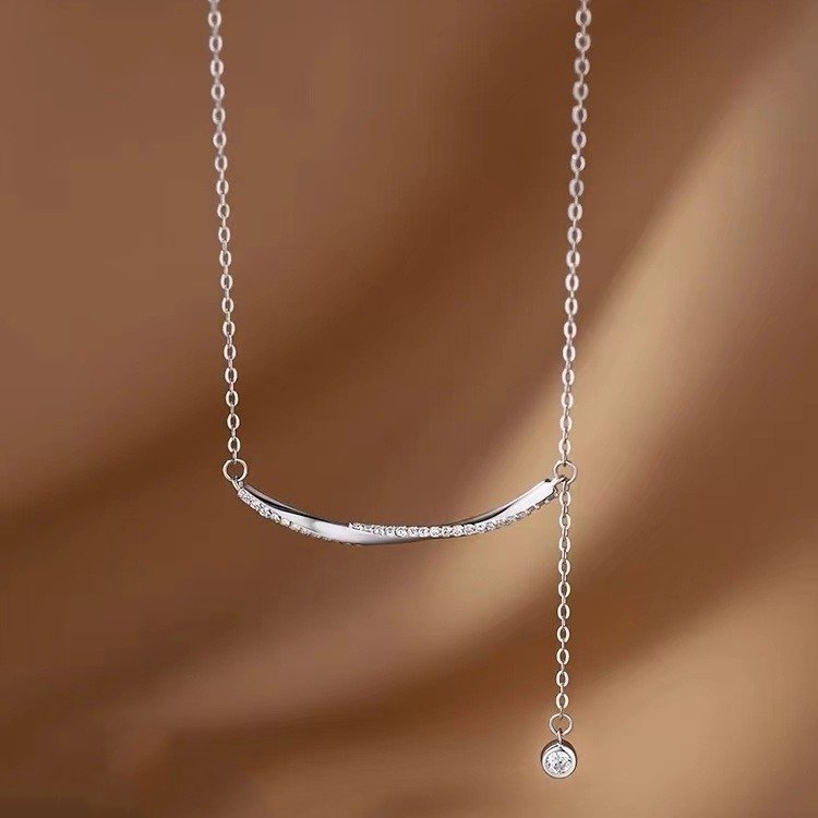Silver Moonwave Lucky Charm Necklace close-up, artisan jewelry with elegant detailing.