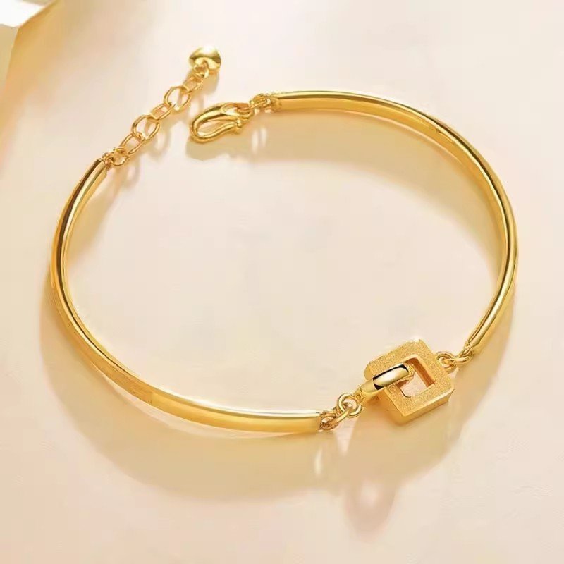Blue Aureum Harmony Bracelet with metal-infused lucky charm, 14k gold bangle for fortune and balance.