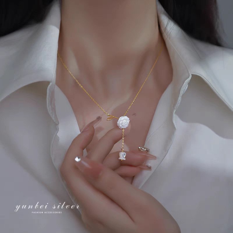 Lunar silver charm necklace with artisan bangle charm bracelet, showcasing balance and grace.