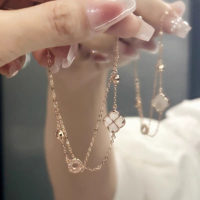 Silver Bloom Lucky Charm Bracelet with layered metal elegance, close-up of charm.