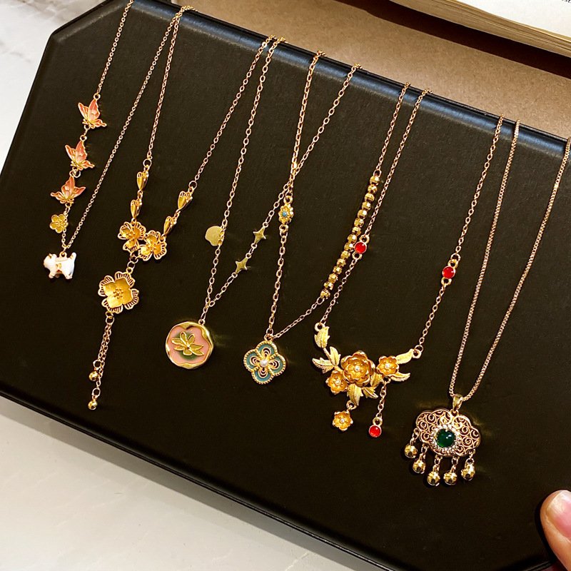 Golden Blossom Alchemy pendant with celestial metal essence on gold chain.