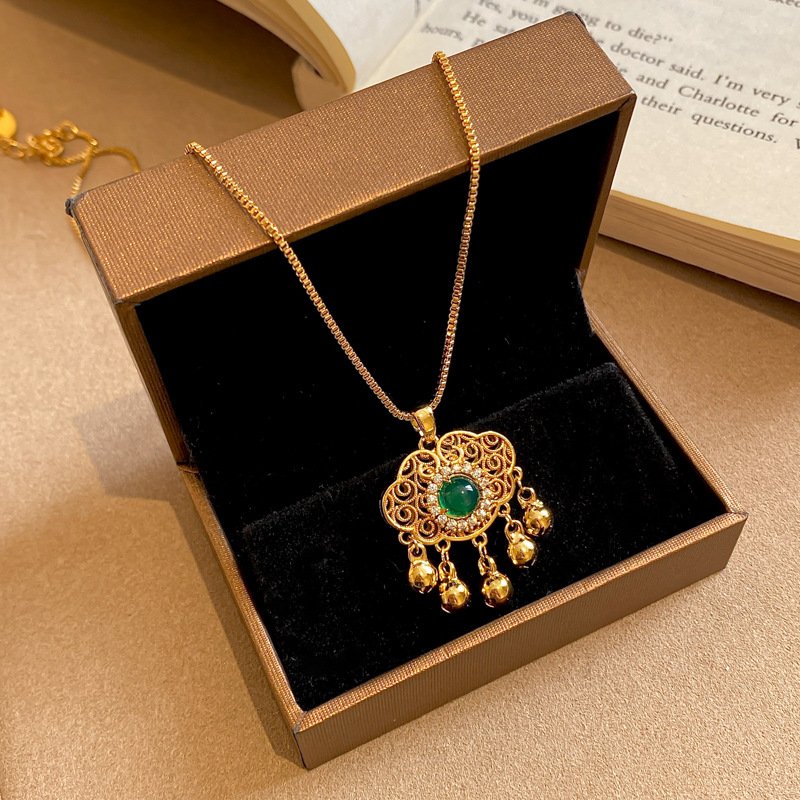 Golden Blossom Alchemy pendant with celestial metal essence on gold chain.