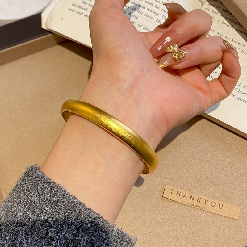 Mystic Gold Essence jade and gold ring with intricate detailing.
