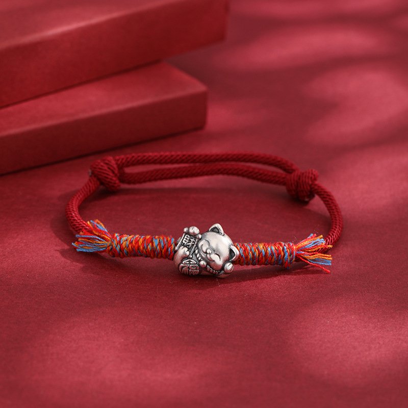 Red string Silverbound Fate Bracelet with metal-forged charm, artisan jewelry.