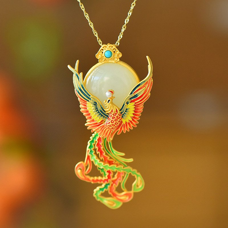 Silver phoenix pendant with ancient Chinese artisan jewelry details.