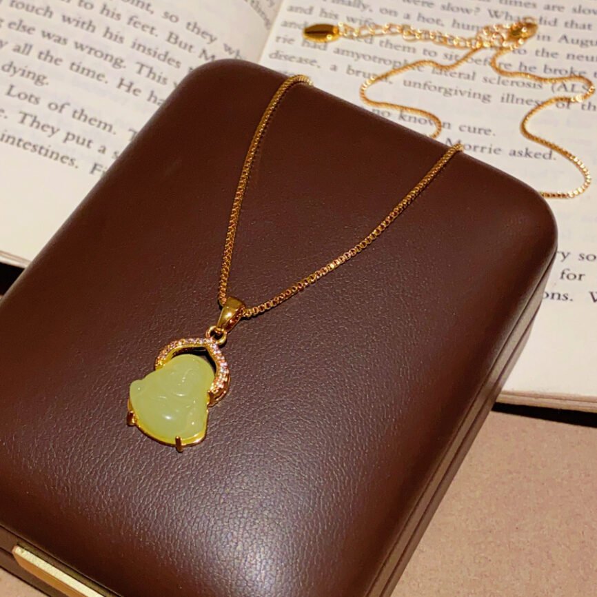 Blue Aureum Nexus pendant on a gold chain, close-up of charm.