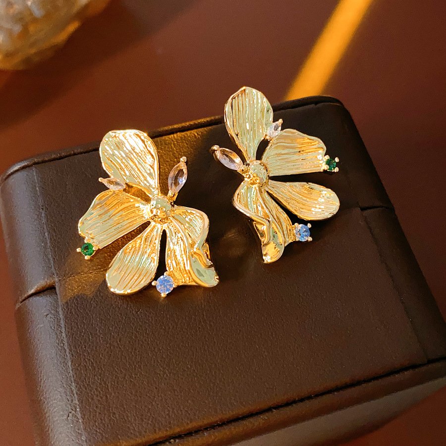 Blue Golden Flow Blossom Drops earrings with radiant metal charm.