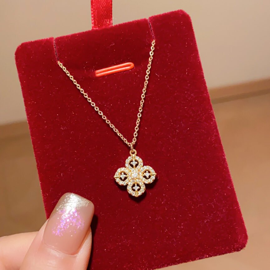 Golden Blossom Aura pendant with radiant metal charm.