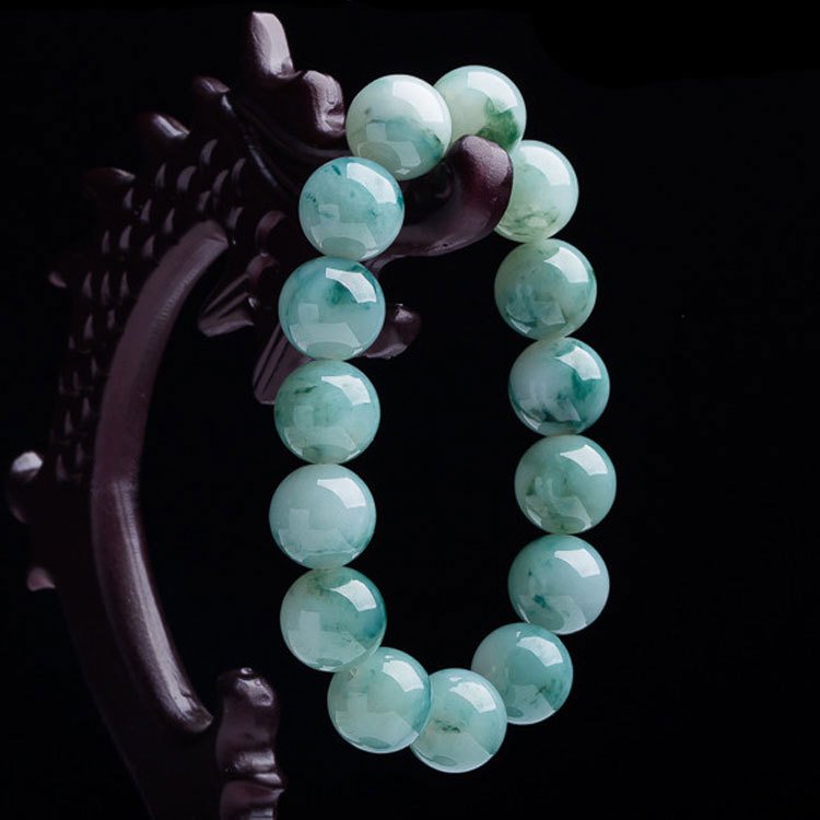 Emerald Grove lucky charm bracelet with nature-inspired design and ancient Chinese motifs.
