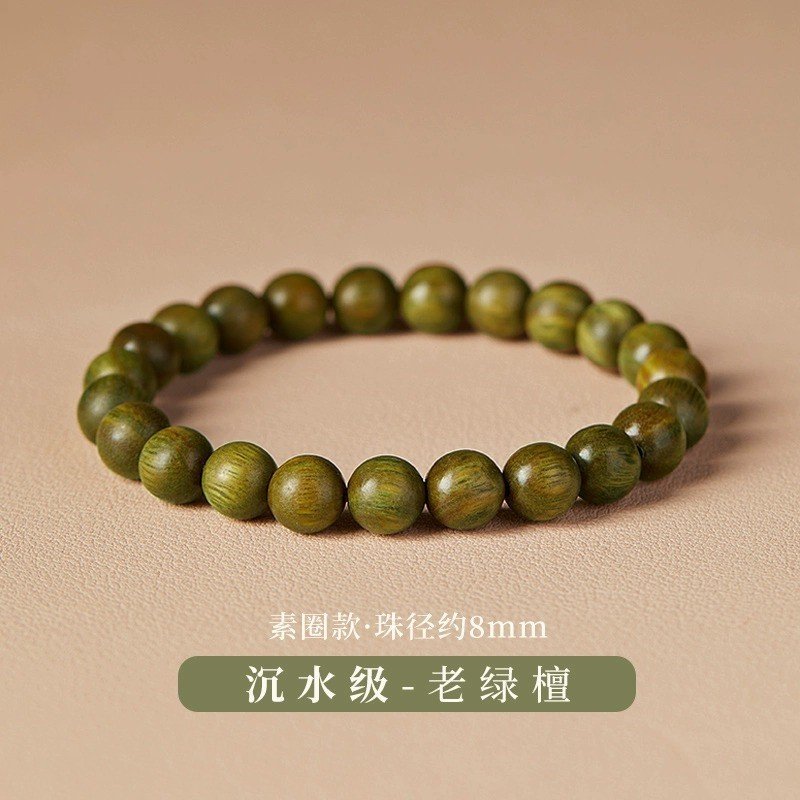 Emerald Breeze red string bracelet with wood charm, symbolizing ancient Chinese harmony.