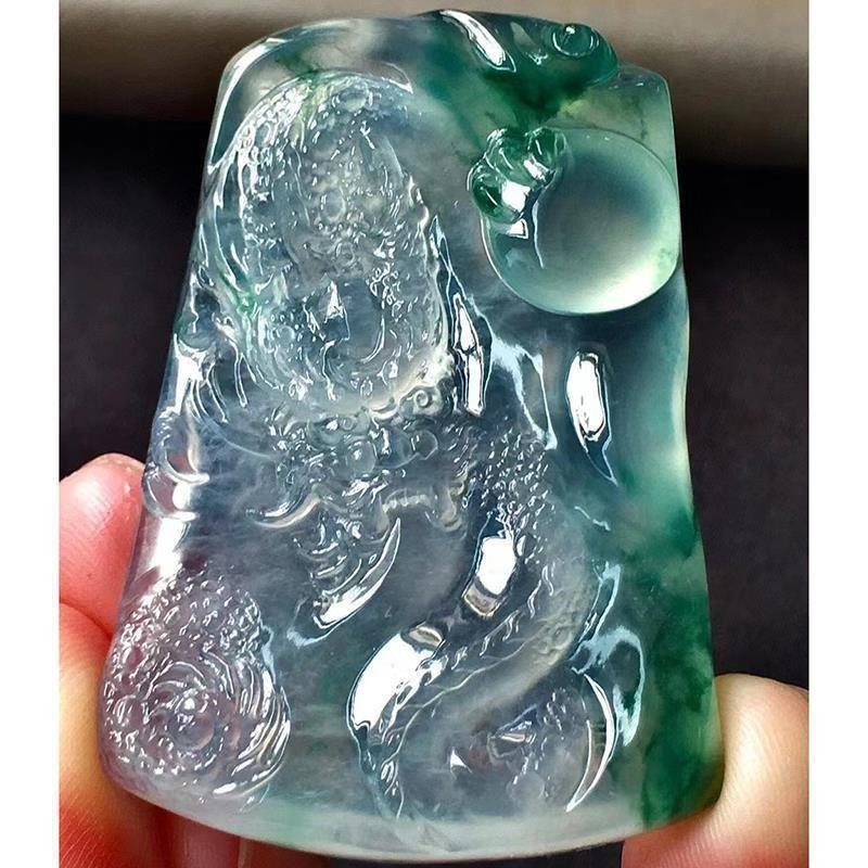 Verdant jade dragon charm, artisan jewelry with intricate Chinese detailing.