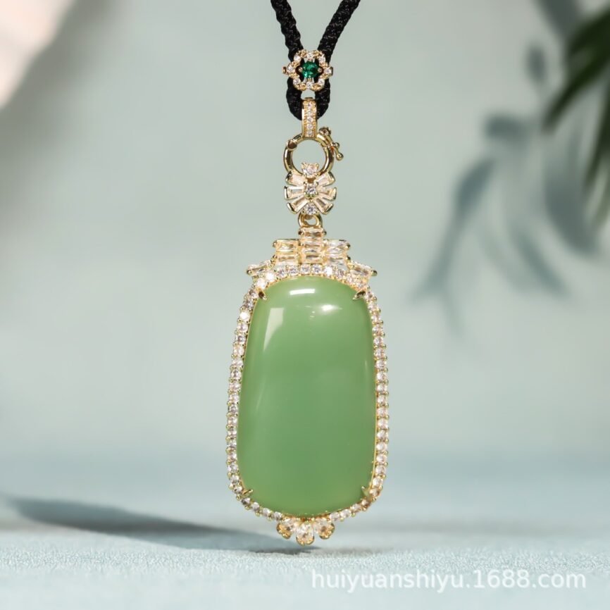 Emerald Breeze jade pendant with wooden accents, close-up view.