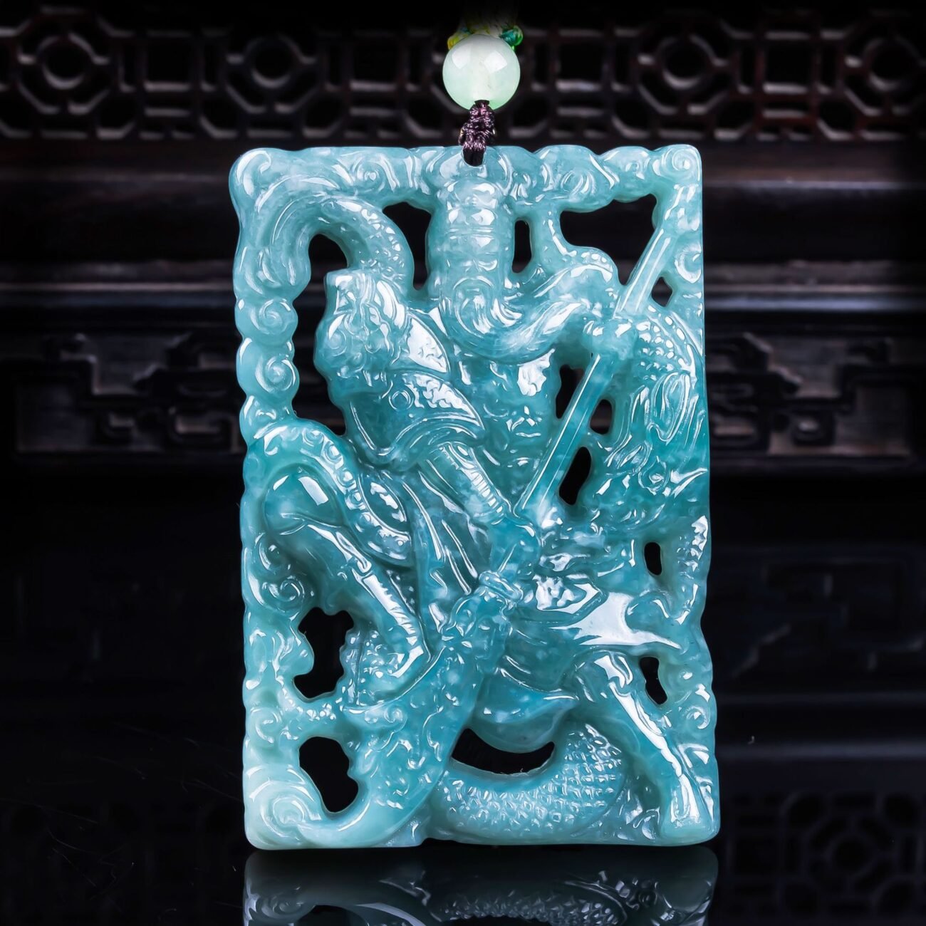 Verdant dragon pendant jewelry with intricate blue charm, artisan-crafted custom name necklace in gold.