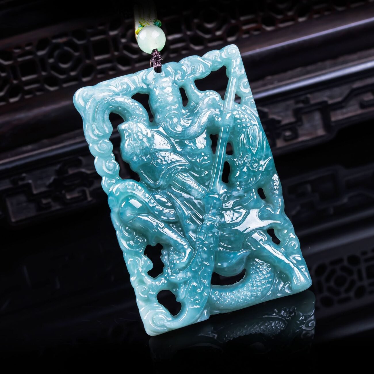 Verdant dragon pendant artisan jewelry, close-up of intricate gold charm.