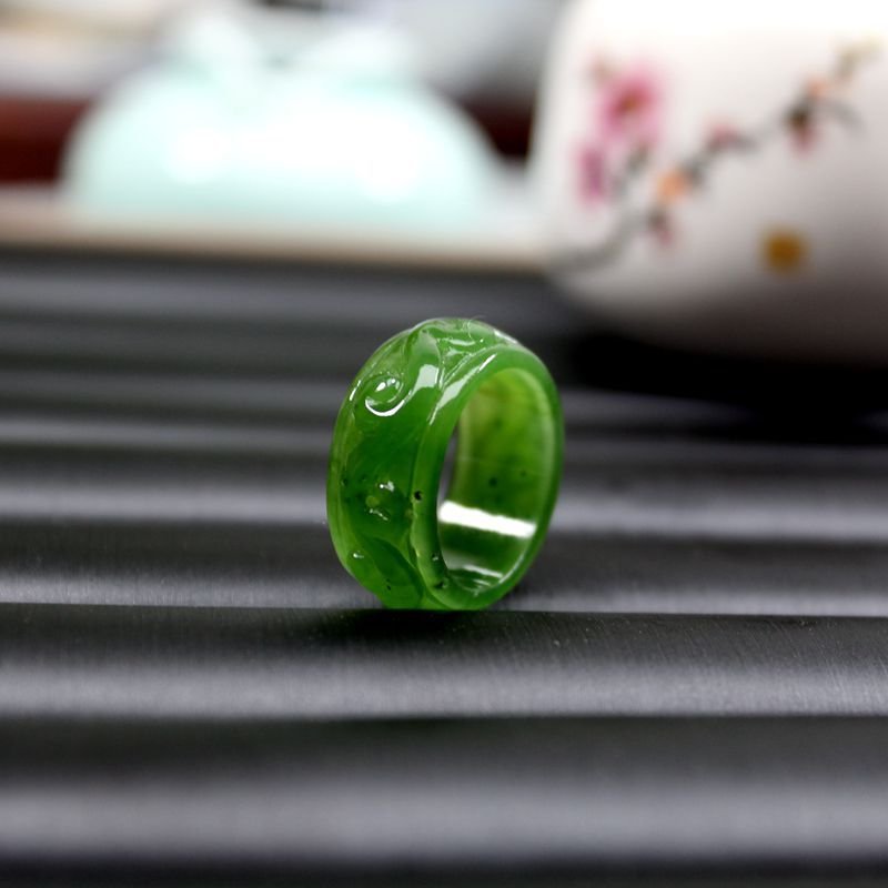 Azure Dragon jade ring, artisan jewelry with intricate blue jade carving.
