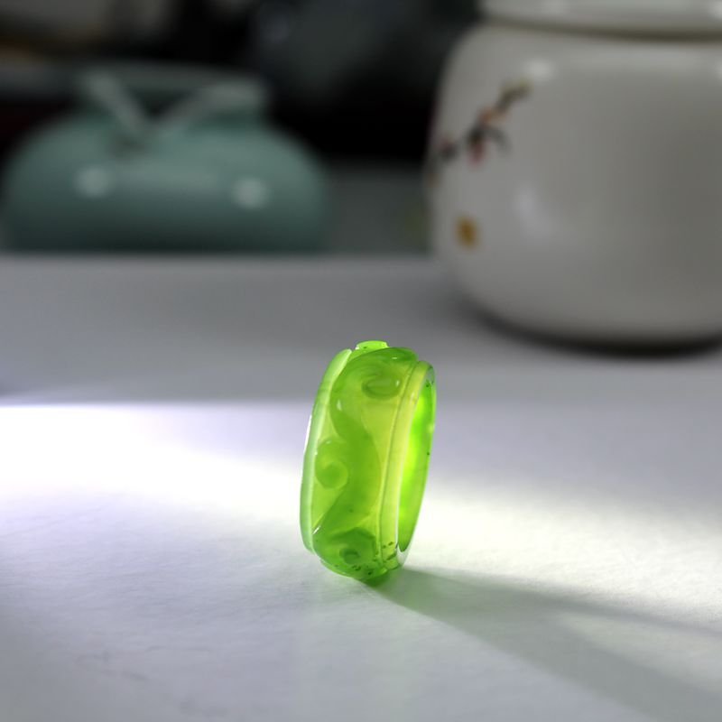 Azure Dragon jade ring with intricate blue carving, artisan jewelry.