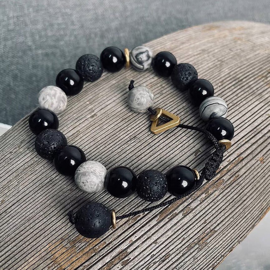 Blue Mystic Ember Harmony lava bangle bracelet with charm, balancing elements.