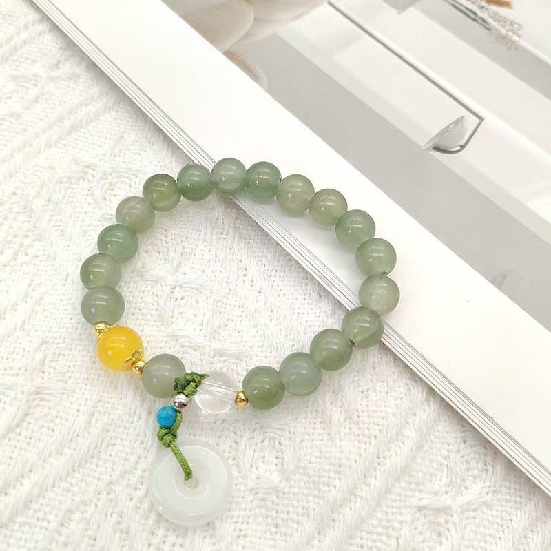 Blue Eternal Flow Taihe pendant charm on elastic bangle bracelet.