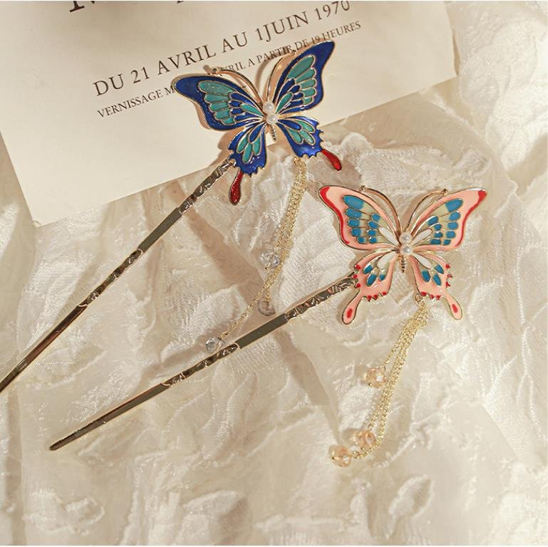 Blue celestial hairpin with dreamy cloud charm, subtle curve.