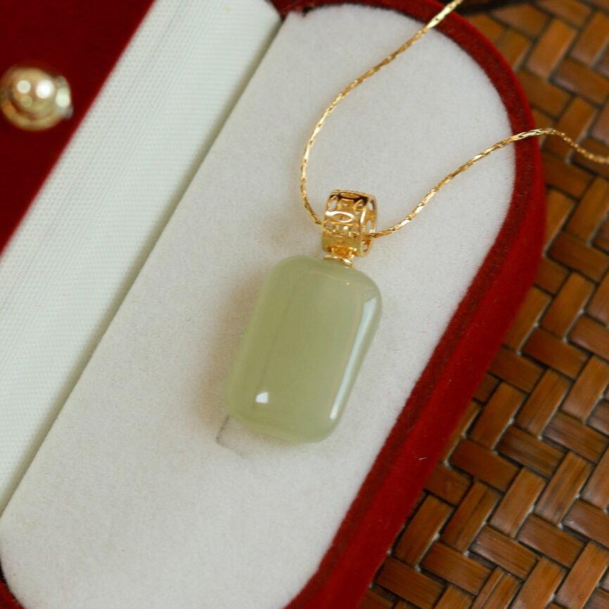 Eternal Balance jade pendant necklace with blue charm, harmonizing energy.
