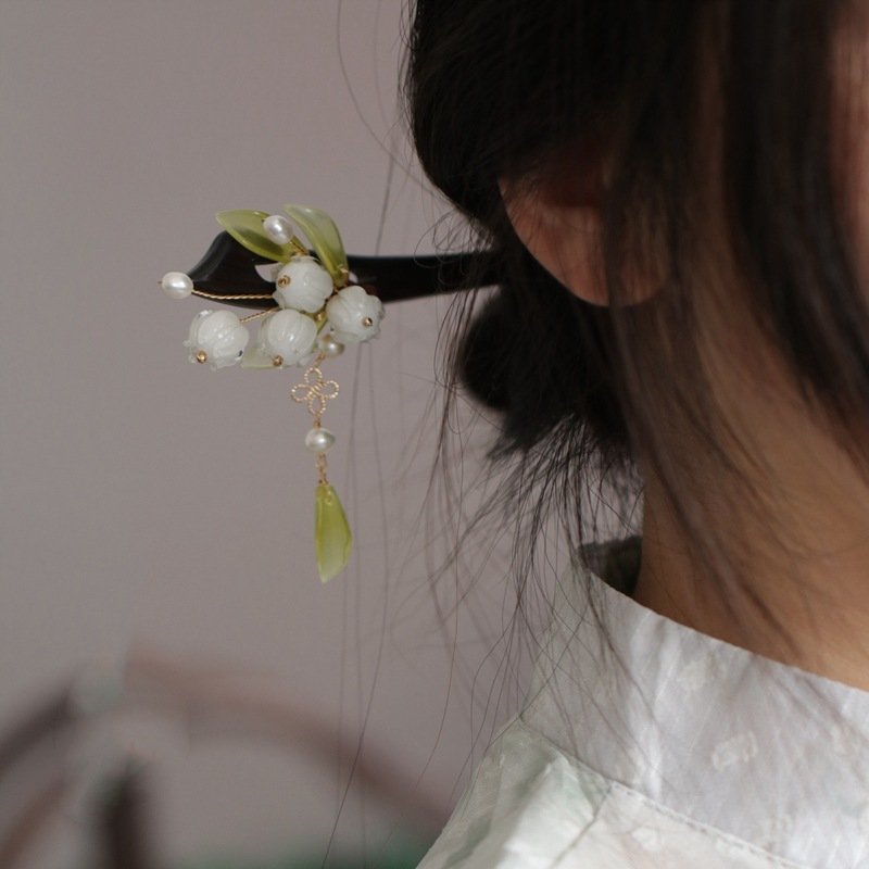 Blue Ethereal Orchid Moon hairpin with cosmic charm detailing.