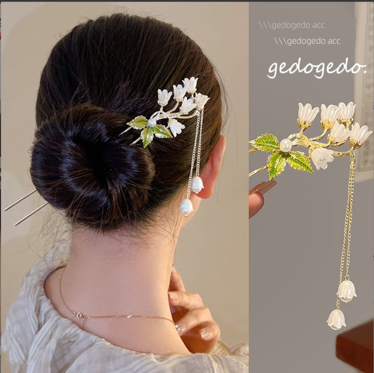 Blue Ethereal Lily Chime Hairpin with delicate charm close-up.