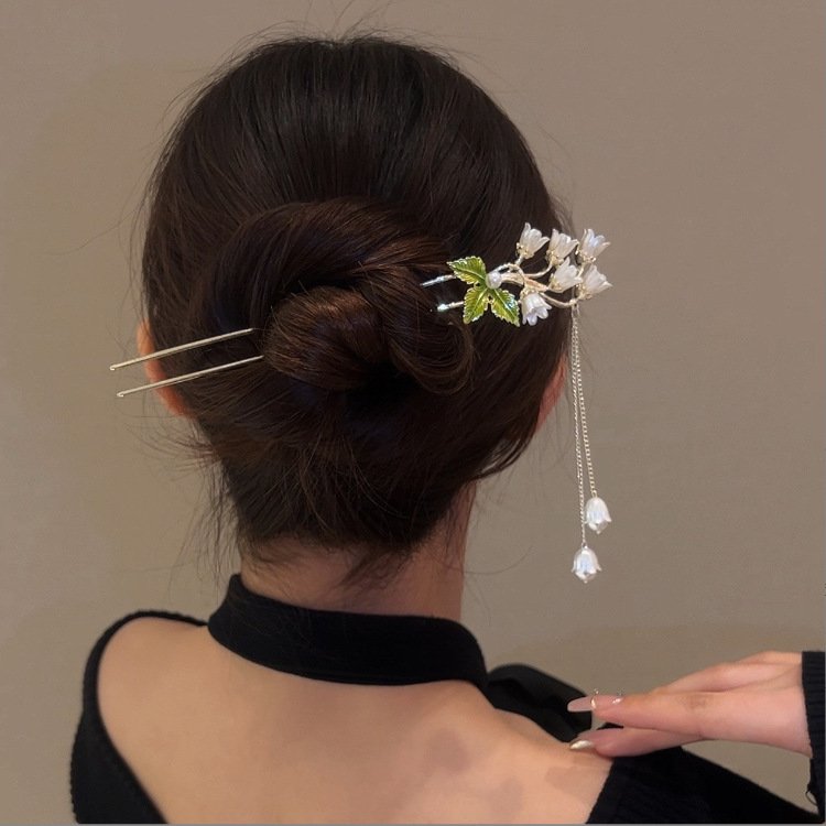 Blue Ethereal Lily Chime Hairpin with delicate charm close-up.