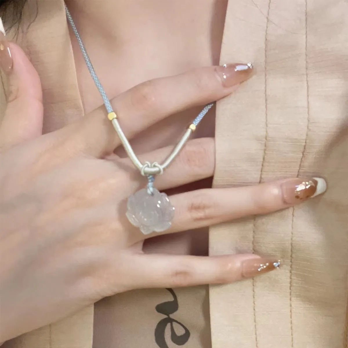 Blue Lotus Essence Qi jade pendant for serene harmony.