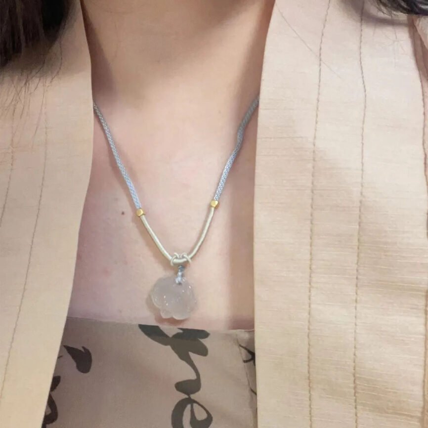Blue lotus essence Qi jade pendant for serene harmony.