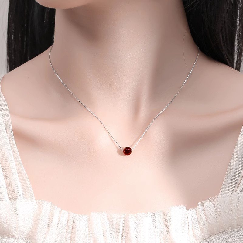 Crimson Aura garnet locket pendant with heart energy charm.