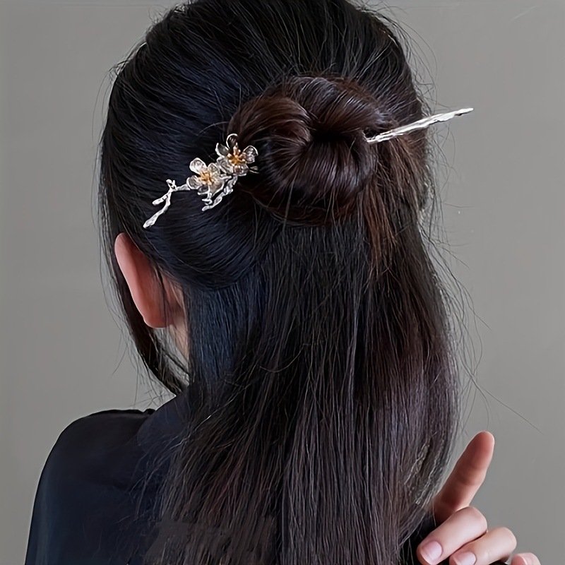 Mystic peach moonlit hairpin with celestial charm, close-up view.