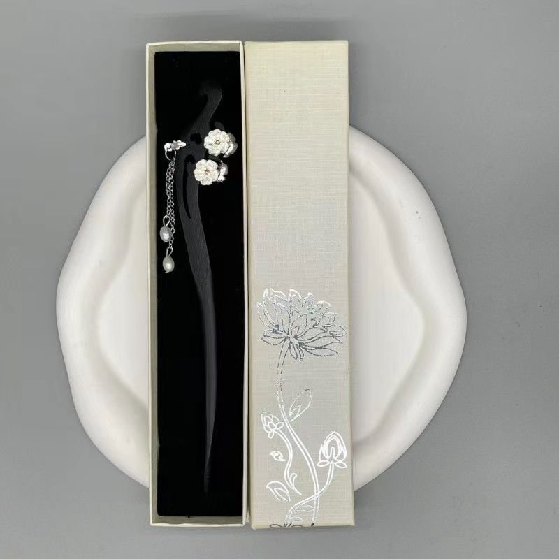Blue Ethereal Lotus hairpin with delicate charm, embodying harmony.