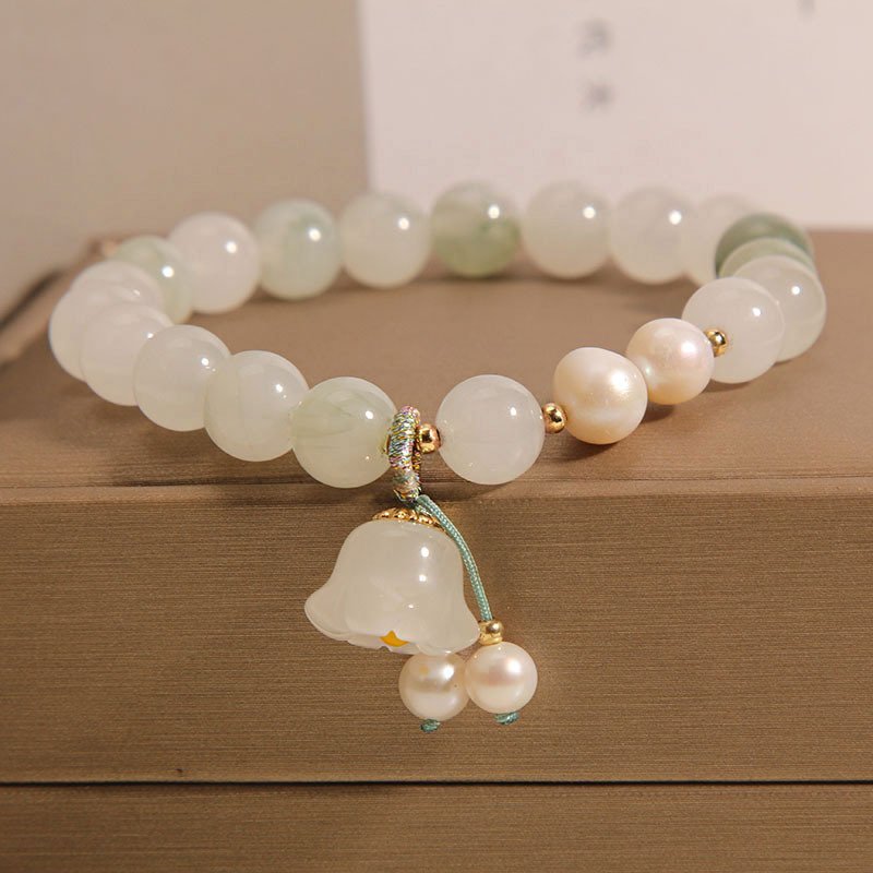 Celestial Chinese Hetian jade pendant with artisan craftsmanship, close-up view.