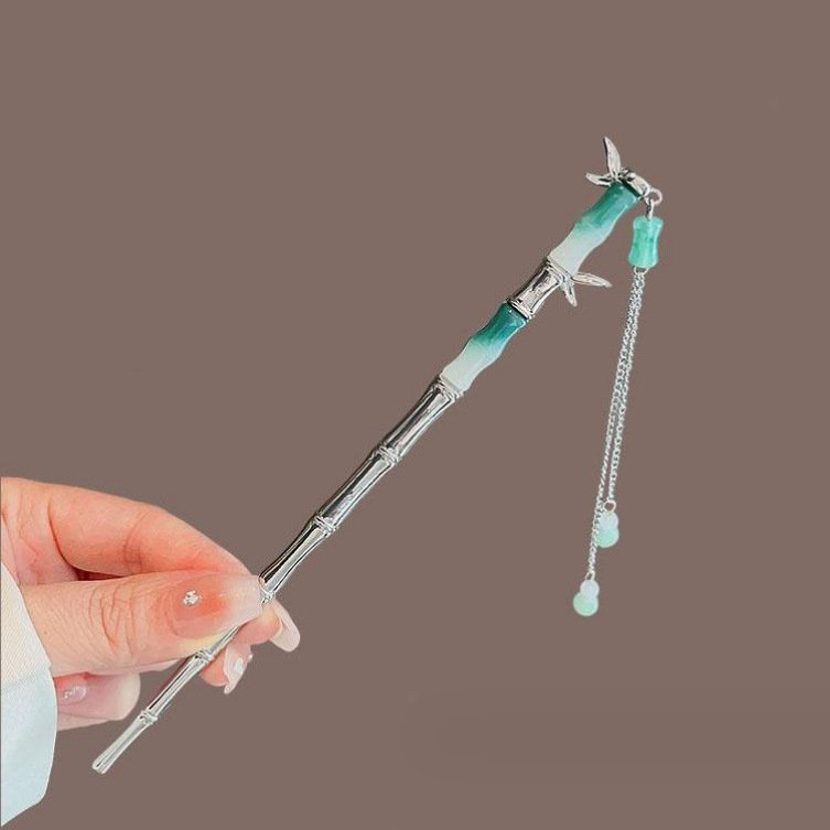 Blue Ethereal Resonance Lily hairpin with celestial charm detail.