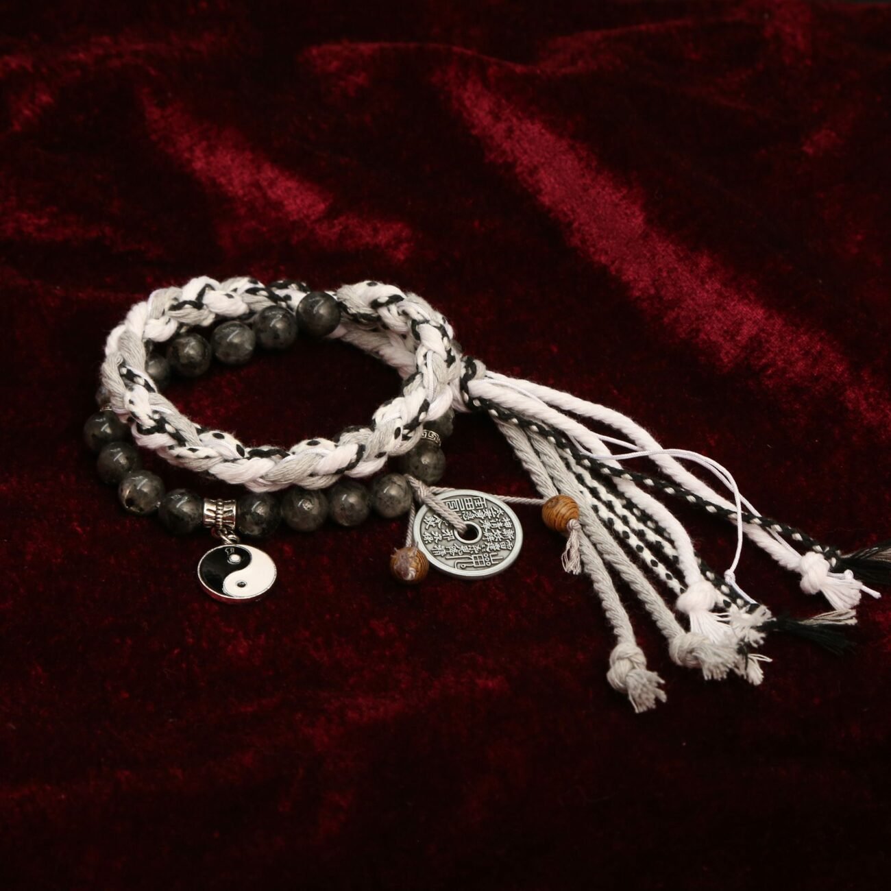 Blue charm bangle bracelet with ancient Chinese lucky symbols for protection.