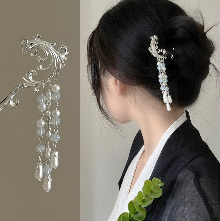 Blue Mistpeak Radiance hairpin with celestial charm close-up.
