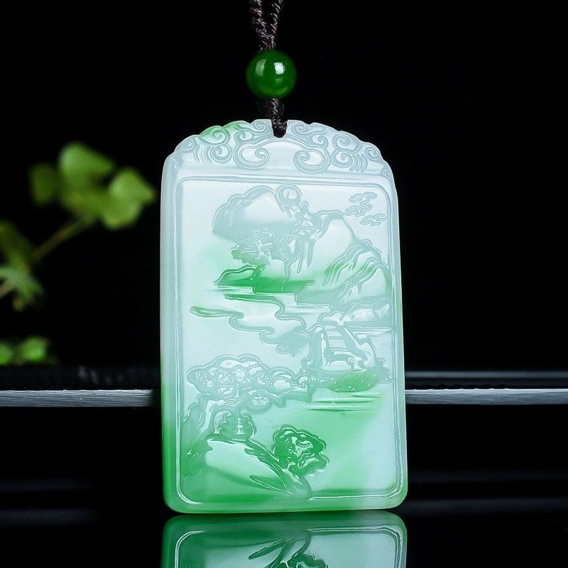 Intricately carved Hetian jade pendant depicting traditional Chinese motifs showcasing skilled craftsmanship
